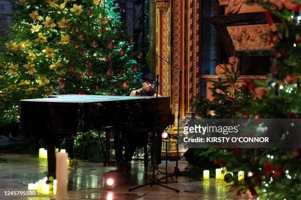Singer Alexis Ffrench performs during the 'Royal Carols: Together At Christmas', at Westminster Abbey in London on December 15, 2022. - The service...