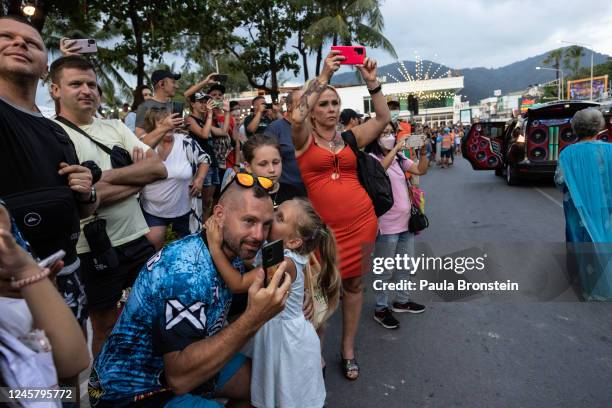 An annual parade takes on the streets as Russian families watch along Patong beach on December 16, 2022 in Phuket, Thailand. Russian tourists have...