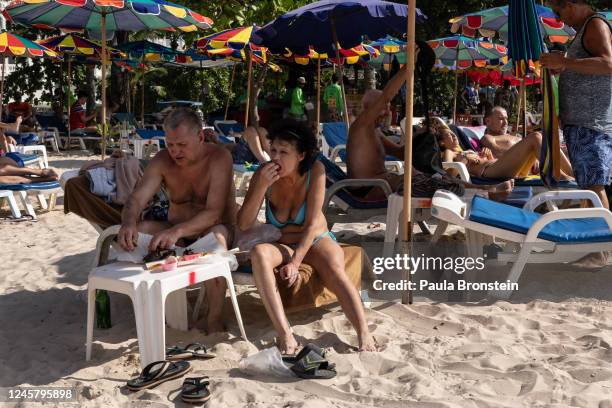 Russian tourists are seen on the popular Patong beach on December 16, 2022 in Phuket, Thailand. Russian tourists have been flocking to Phuket after...