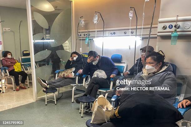 People receive medical attention in a Fever Clinic area in a Hospital in the Changning district in Shanghai, on December 23, 2022 - China is battling...