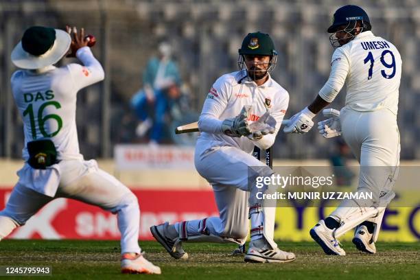 Bangladesh's Litton Das takes a catch to dismiss Indias Umesh Yadav during the second day of the second cricket Test match between Bangladesh and...