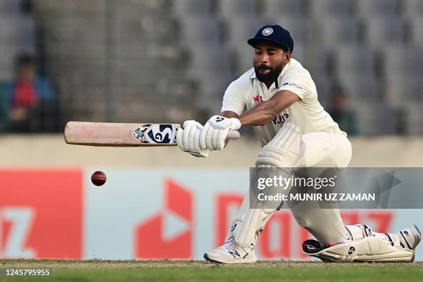 India's Mohammed Siraj plays a shot during the second day of the second cricket Test match between Bangladesh and India at the Sher-e-Bangla National...