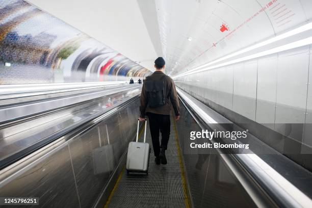 Traveler on a near empty moving walkway, during a nationwide strike by SNCF ticket inspectors, at Gare Montparnasse train station in Paris, France,...