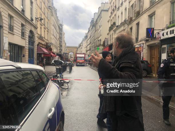 Police cordon-off an area after a gunfire left two people dead and four injured in Paris, while a suspect had been arrested, in France on December...