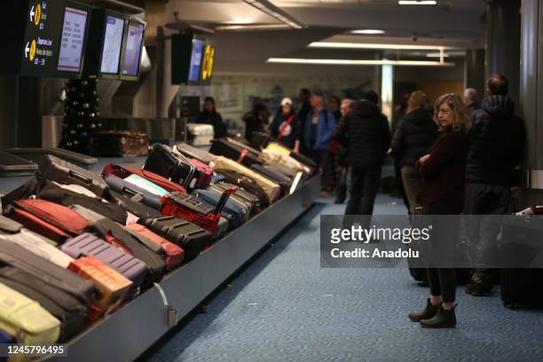 Passengers wait for their bags and luggage at Vancouver International Airport's domestic arrivals on December 22, 2022 in Vancouver, BC, Canada. 115...