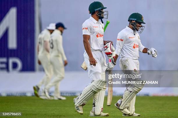 Indias Nazmul Hasan Santo and Zakir Hasan walk off the field after the second day of the second cricket Test match between Bangladesh and India at...