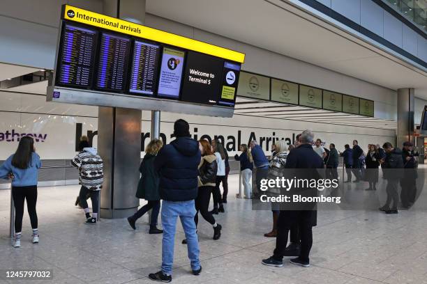 Visitors wait for airline passengers in the arrivals hall at Heathrow Airport Terminal 5 in London, UK, on Friday, Dec. 23, 2022. Passengers at UK...