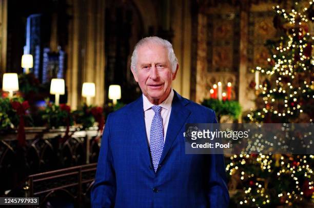 In this image released on December 23, King Charles III is seen during the recording of his first Christmas broadcast in the Quire of St George's...