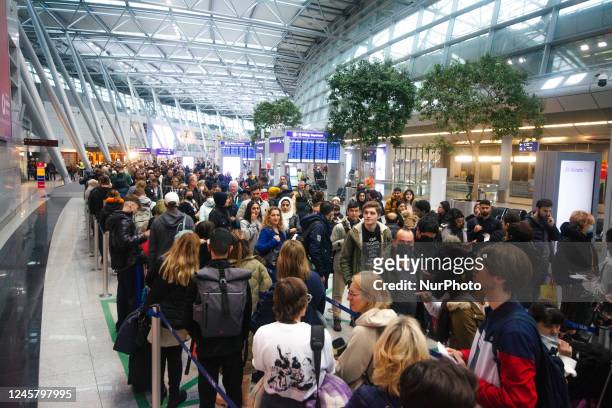 General view of a crowd of people waiting for the security check at Duesseldorf Airport in Germany on December 23rd ahead of the Christmas holiday is...