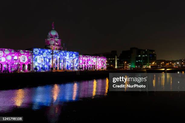 Night view of the Custom House with Christmas illumination by the Dublin Winter light, a Christmas decoration festival for the city of Dublin .