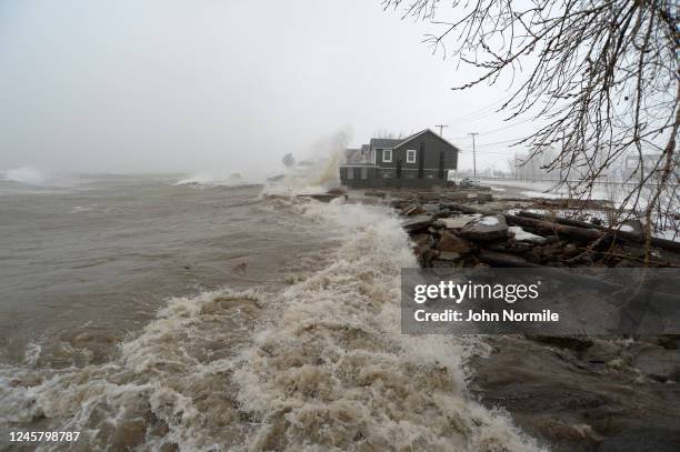 Lake Erie waters wash over the shoreline on December 23, 2022 in Hamburg, New York. The Buffalo suburb and surrounding area are expecting wind gusts...