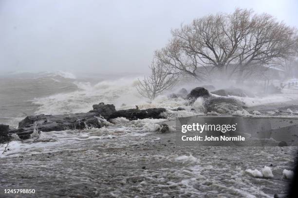 Lake Erie waters wash over the shoreline on December 23, 2022 in Hamburg, New York. The Buffalo suburb and surrounding area are expecting wind gusts...