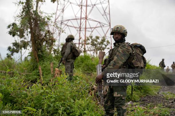 Rebels patrol their area in Kibumba in the eastern Democratic Republic of Congo, on December 23, 2022. - DR Congo's M23 rebels on December 23, 2022...