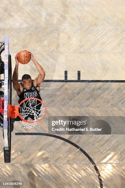 Nicolas Claxton of the Brooklyn Nets dunks the ball after a dime pass from Kyrie Irving during the game against the Milwaukee Bucks on December 23,...