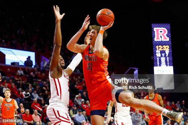 Jake van der Heijden of the Bucknell Bison attempts a shot as Aundre Hyatt of the Rutgers Scarlet Knights defends during the first half of a game at...