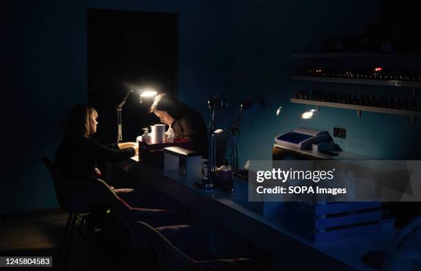Ladies seen at the nail salon in Kyiv during the blackout. As a result of massive missile attacks on Ukraine's electric power infrastructure by...