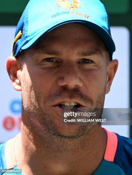 Australian batsman David Warner speaks during a press conference at the Melbourne Cricket Ground ahead of the second cricket Test match between...