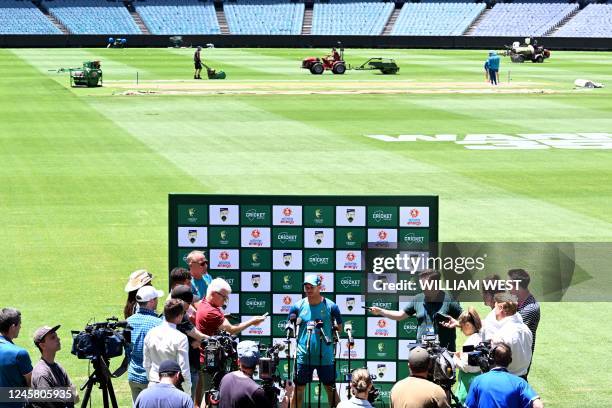 Australian batsman David Warner speaks during a press conference at the Melbourne Cricket Ground ahead of the second cricket Test match between...