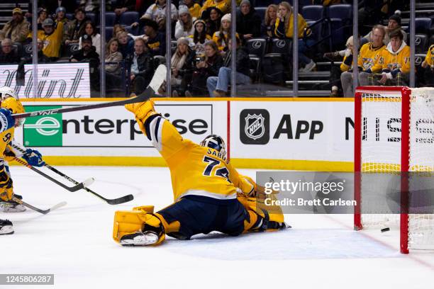 Juuse Saros of the Nashville Predators fails to stop the game winning shot by Samuel Girard of the Colorado Avalanche during overtime at Bridgestone...