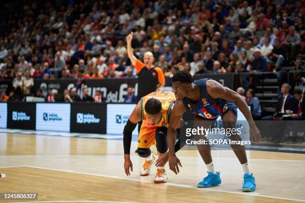 Jasiel Rivero of Valencia basket and James Nnaji of FC Barcelona in action during the J15 Turkish Airlines Euroleague at Fuente de San Luis Sport...