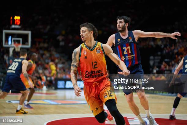 Jonah Radebaugh of Valencia basket and Alex Abrines of FC Barcelona in action during the J15 Turkish Airlines Euroleague at Fuente de San Luis Sport...