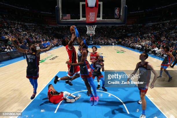 Herbert Jones of the New Orleans Pelicans attempts to shoot the ball but it is blocked by defender Shai Gilgeous-Alexander of the Oklahoma City...