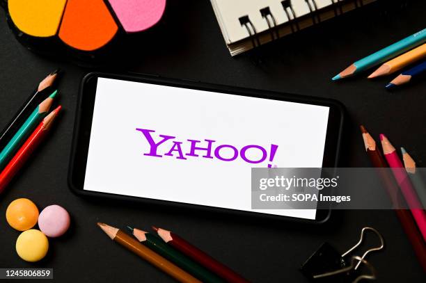 In this photo illustration a Yahoo logo seen displayed on a smartphone.