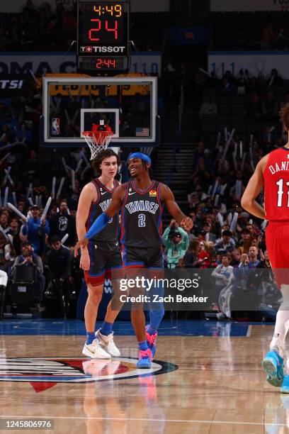 Shai Gilgeous-Alexander of the Oklahoma City Thunder smiles during the game against the New Orleans Pelicans on December 23, 2022 at Paycom Arena in...