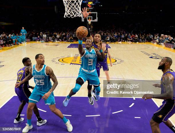 Terry Rozier of the Charlotte Hornets scores a basket against Russell Westbrook of the Los Angeles Lakers during the asecond half at Crypto.com Arena...