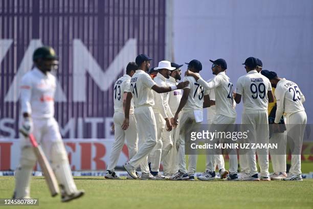 Indias cricketers celebrate after the dismissal of the Bangladeshs Jakir Hasan during the third day of the second cricket Test match between...