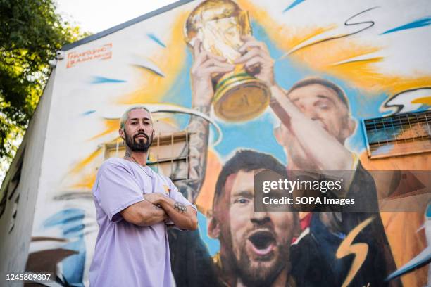 The artist, Maximiliano Bagnasco, poses in front of his work in Buenos Aires. The Argentine artist, Maximiliano Bagnasco is the first to capture...