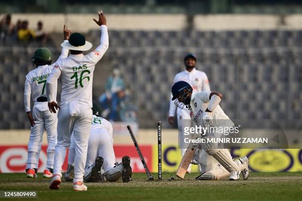 Bangladeshs Nurul Hasan reacts after the dismissal of Indias Cheteshwar Pujara during the third day of the second cricket Test match between...