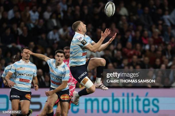 Racing92's Scottish fly-half Finn Russell jumps to catch the ball during the French Top14 rugby union match between Racing92 and Stade Francais at...