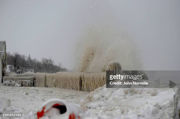 Ice and snow cover a railing along the Lake Erie shoreline on December 24, 2022 in Hamburg, New York. The Buffalo suburb and surrounding area was hit...