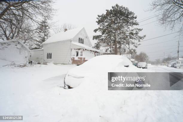 Snow covers a vehicle on December 24, 2022 in Hamburg, New York. The Buffalo suburb and surrounding area was hit hard by the winter storm Elliott...