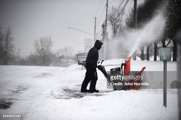 Keith Wojciechowski clears his driveway on December 24, 2022 in Hamburg, New York. The Buffalo suburb and surrounding area was hit hard by the winter...