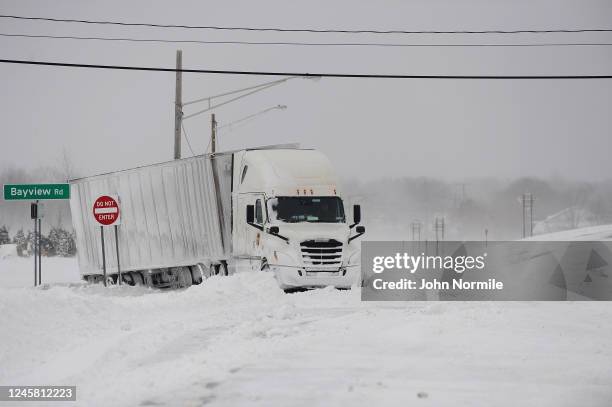 Truck remains stuck in snow along the Lake Erie shoreline on December 24, 2022 in Hamburg, New York. The Buffalo suburb and surrounding area was hit...