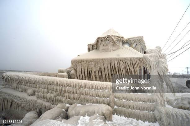 Ice covers Hoaks restaurant along the Lake Erie shoreline on December 24, 2022 in Hamburg, New York. The Buffalo suburb and surrounding area was hit...