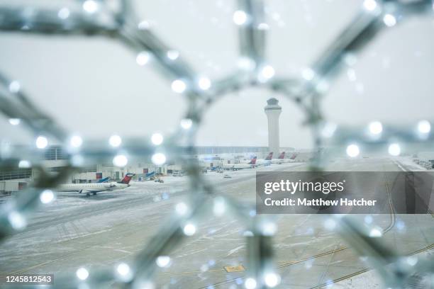 Holiday travelers crowd the Detroit Wayne County Metro Airport on Christmas Eve following Winter Storm Elliot December 24, 2022 in Detroit, Michigan....