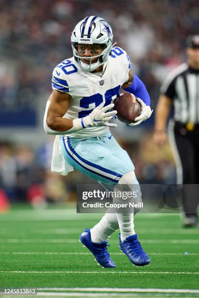 Running back Tony Pollard of the Dallas Cowboys runs with the ball against the Philadelphia Eagles during the first half at AT&T Stadium on December...