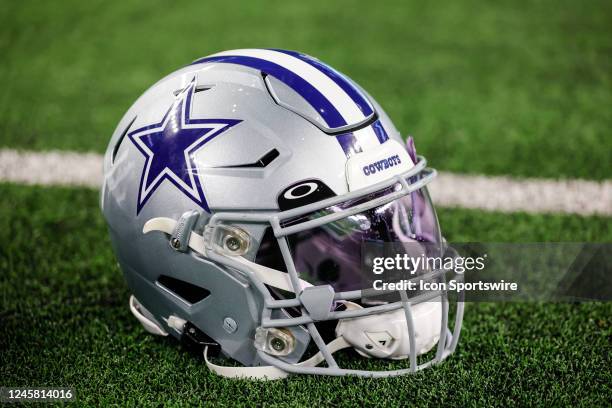 Dallas Cowboys helmet sits on the ground during the game between the Dallas Cowboys and the Philadelphia Eagles on December 24, 2022 at AT&T Stadium...