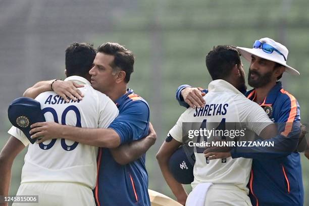 Indias coach Rahul Dravid congratulates Ravichandran Ashwin as batting coach Vikram Rathour hugs Shreyas Iyer after winning on the fourth day of the...