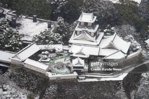 Photo taken from a Kyodo News helicopter on Dec. 23 shows Kochi Castle in western Japan dusted with snow.