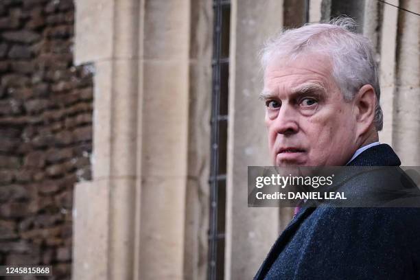 Britain's Prince Andrew, Duke of York reacts as he arrives for the Royal Family's traditional Christmas Day service at St Mary Magdalene Church in...