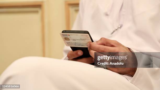 Citizens use their votes by phone as part of online voting system during local elections in Muscat, Oman on December 25, 2022.