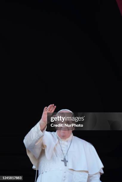 Pope Francis waves to faithful at the end of the Urbi et Orbi Christmas' day blessing from the main balcony of St. Peter's Basilica at the Vatican,...