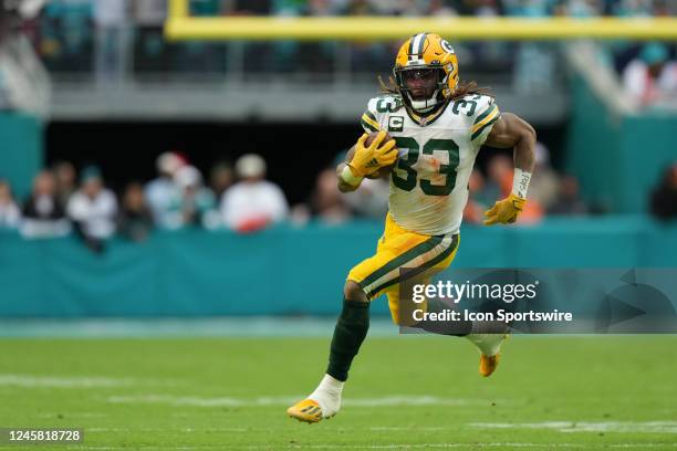 Green Bay Packers running back Aaron Jones runs for a first down in the second half during the game between the Green Bay Packers and the Miami...