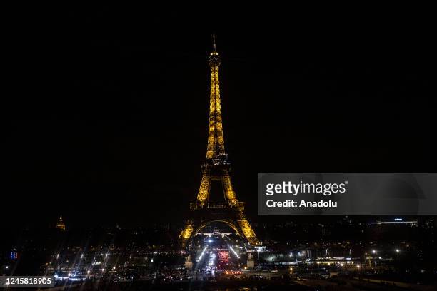 Views of the illuminated Eiffel Tower at night in Paris, France on December 25, 2022. Thousands of people take to the streets to enjoy the day after...
