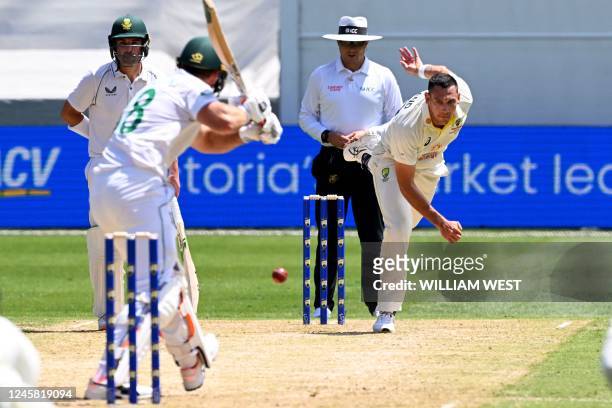 Australian bowler Scott Boland sends down a delivery to South African batsman Theunis de Bruyn on the first day of the second cricket Test match...