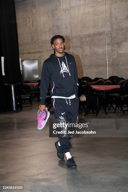 Ja Morant of the Memphis Grizzlies arrives to the arena holding his new Nike Signature Shoe, the Ja 1 "Day One",, the Ja 1 "Day One", before the game...